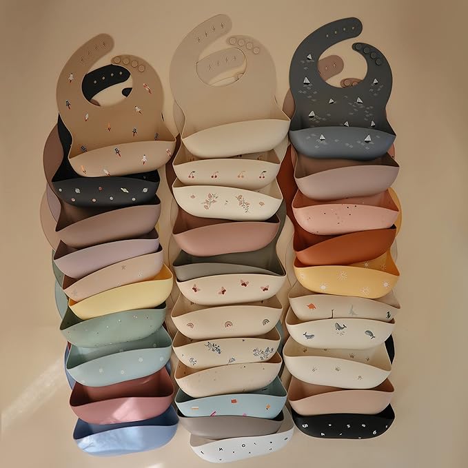 mushie Silicone Baby Bib | Adjustable Fit Waterproof Bibs (Rocket Ship)
