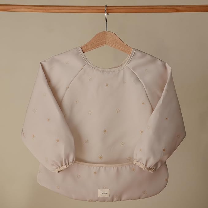 mushie Long Sleeve Baby Bib | Water Resistant Adjustable Fit for Ages 6-24 Months