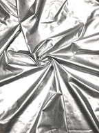 Polyester Spandex Shiny Silver Faux Vinyl 2 Ways Stretch Fabric by Unknown